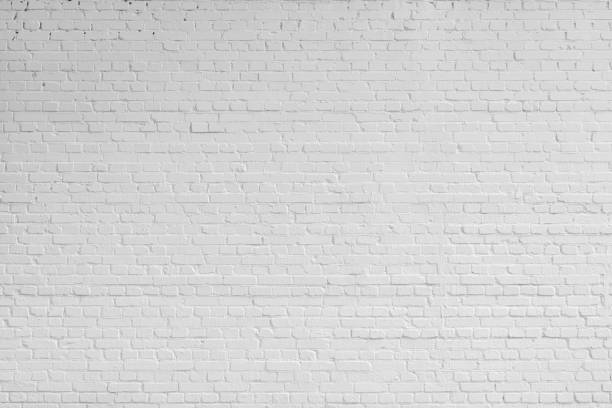 White brick wall. Designer interior background. Abstract architectural surface. home industry stock pictures, royalty-free photos & images