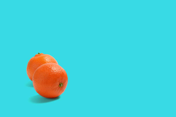 istock Tangerine or Mandarin. On Colored Background. 1250920798