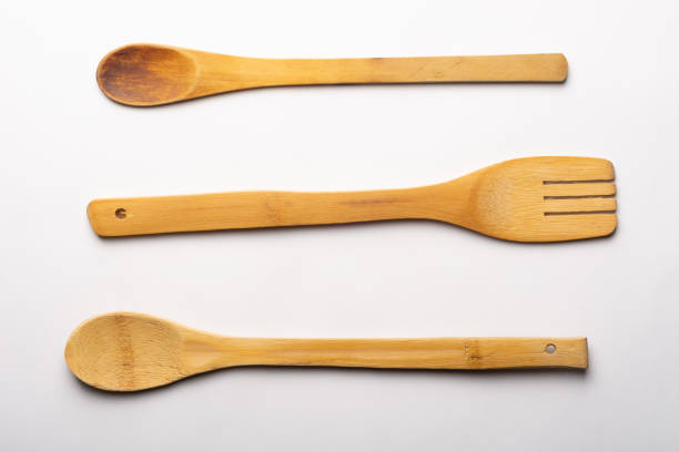 istock Vintage Wooden Spoons and Fork on White Textured Paper. Kitchen and Cooking Concept. 1250920964
