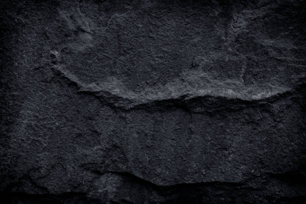 istock black stone natural background, dark grey slate 1250921813