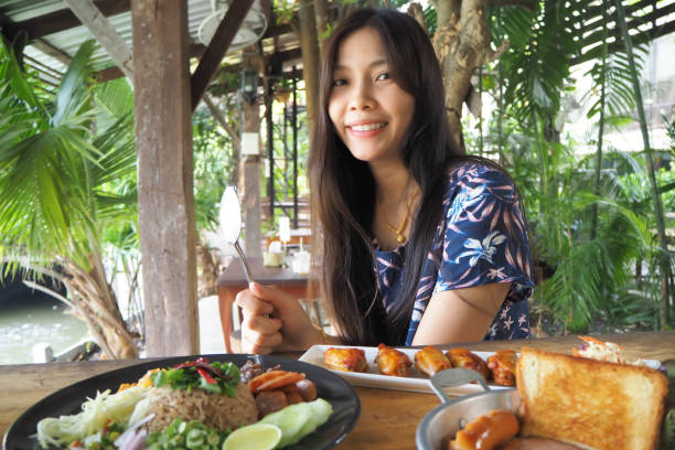 istock Women and Thai food