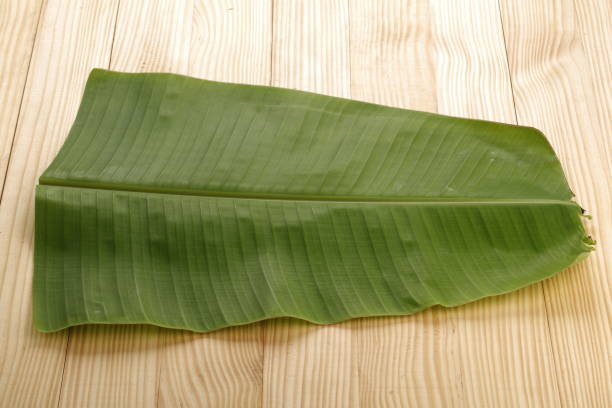 istock Banana leaf_wooden BG 1250923203