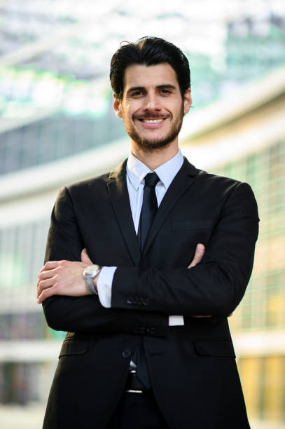 istock Young businessman outdoor smiling confidently 1250924355