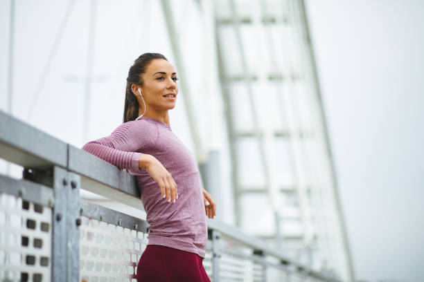 istock Female athlete resting from jogging outdoors 1250925676