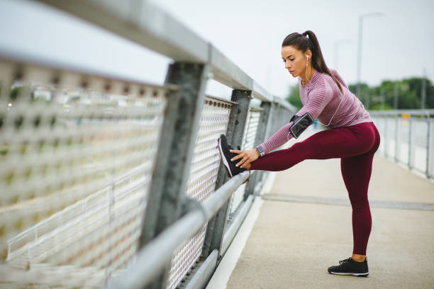 istock Young sportswoman warming up before training outdoors 1250926569