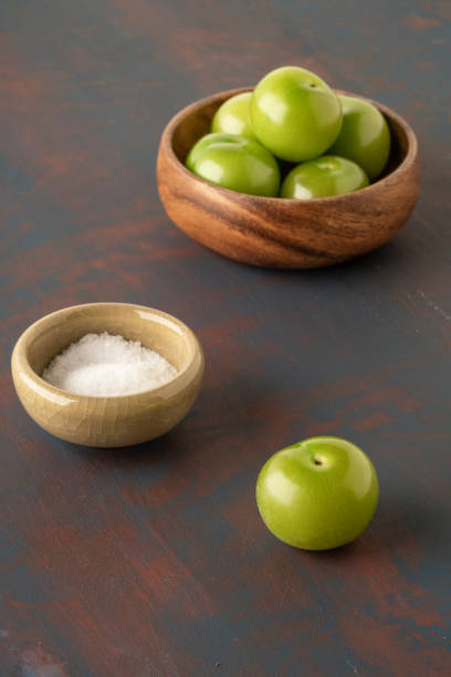 istock closeup fresh and ripe green plums on a table served with salt 1250926621