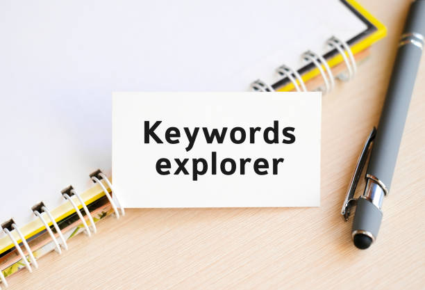istock Keywords explorer - text on a notebook with a spring and a gray pen 1250927755