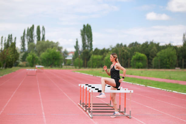 istock runner on warm-up race track before running 1250928072