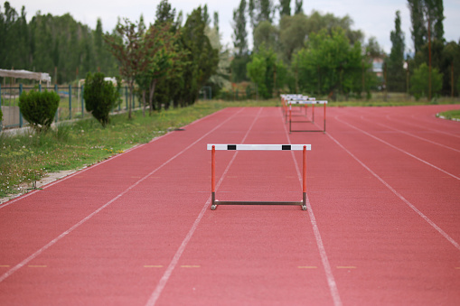 Row of hurdles for a track and field sprint hurdle race.