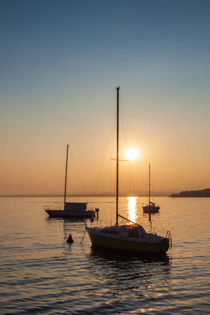 istock Sailboat On Calm Lake Garda With Colourful Sunset 1250929815