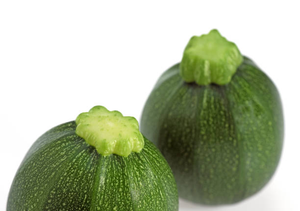 istock Round Courgette or Zucchini, cucurbita pepo, Vegetable against White Background 1250930037
