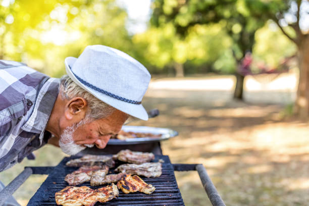 istock Barbecue outdoor in summer. Man cooking. 1250938841