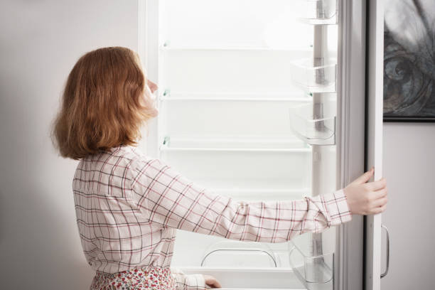 istock teen girl by the empty fridge 1250941014