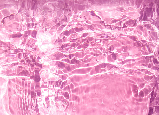 istock Cosmetic moisturizer water toner pink herbal extract on water background 1250946114
