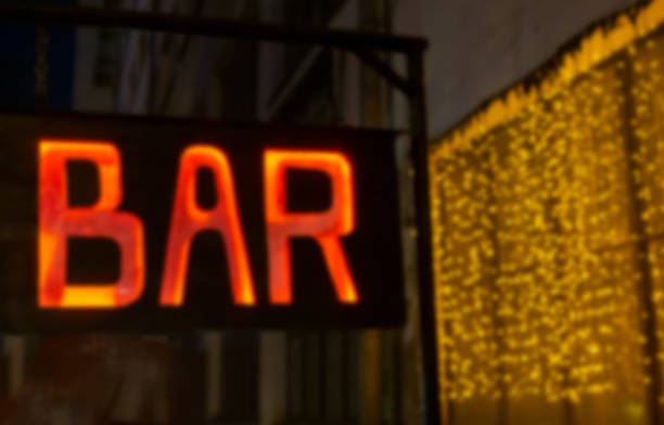 istock blurred red inscription bar and garland lights 1250946446