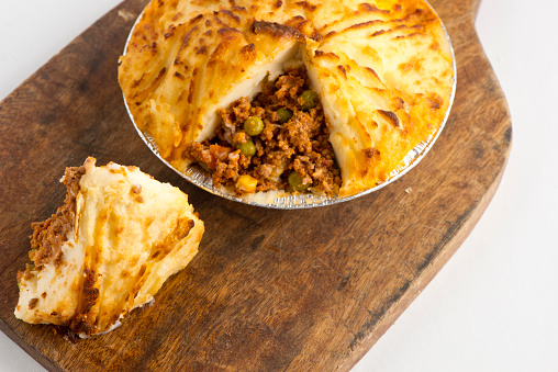 Sheppards pie. Classic British diner or restaurant favourite. Ground beef sautéed with garlic, onions carrots, corn, peas and seasoned with herbs and spices and topped with garlic whipped mashed potatoes and oven baked.
