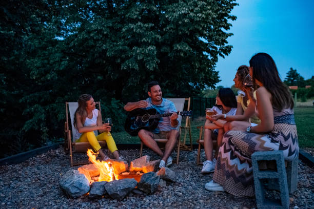 istock Enjoying around camp fire in the summer. 1250949508