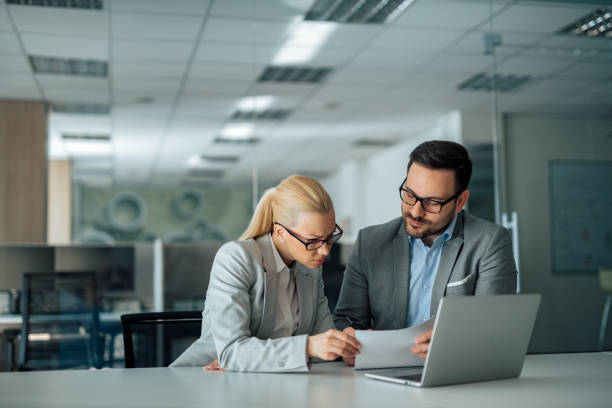 istock Business partners working together in the office, portrait. 1250949618