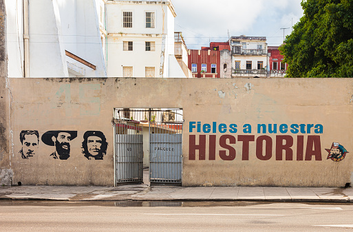 Havana, Cuba-October 7, 2016. Iconic painting of Julio Antonio Mella, Camilo Cienfuegos, Ernesto Che Guevara with words 