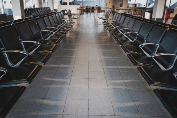 istock empty seats in waiting lounge on airport - 1250954758