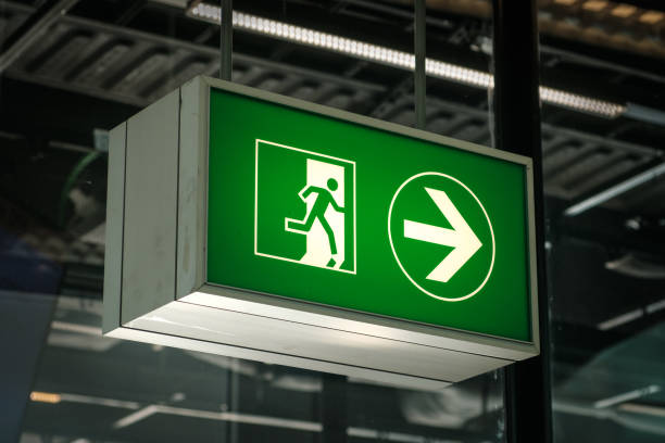 istock Emergency Exit sign on airport closeup - 1250954818