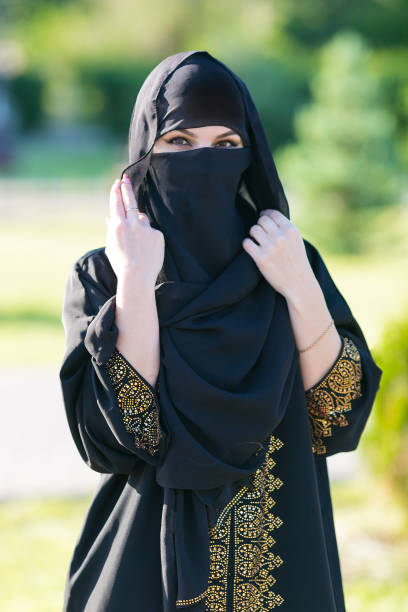 istock Arab woman in a black scarf on her head. 1250955983
