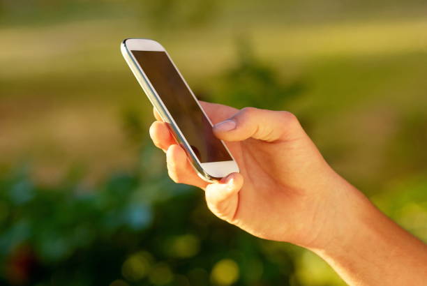 istock Close-Up Of Person Using Mobile Phone 1250956880