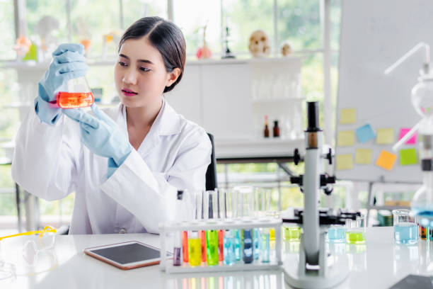 istock Beautiful Asian scientist woman lab technical service observe liquid sample with lab glassware and test tubes in chemical laboratory background, science laboratory research and development concept. 1250959681