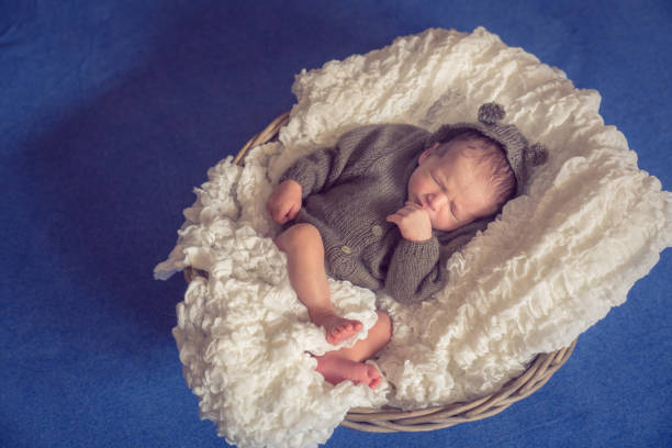 istock Newborn baby Sleeping in Wooden Basket 1250961005