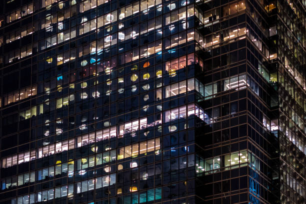 istock office building facade at night - business district - 1250961911