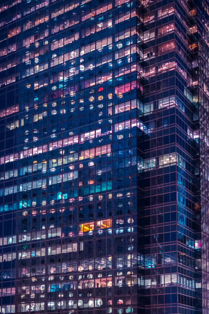 istock office building facade at night - business district - 1250961912