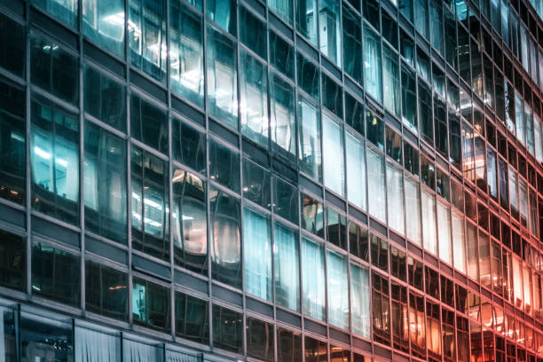 istock office building facade at night - business district - 1250961915