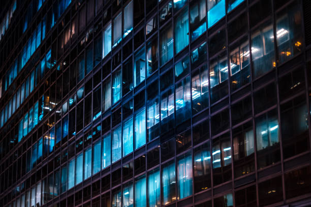 istock office building facade at night - business district - 1250961916