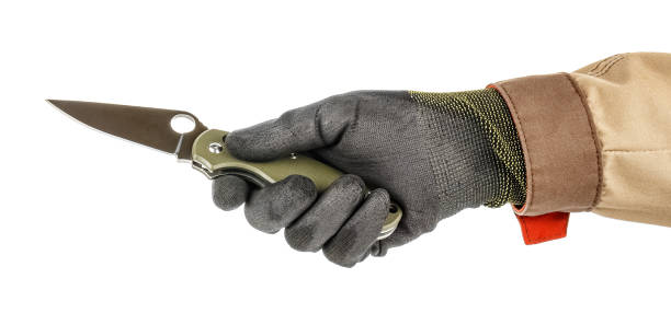 istock Worker hand in black protective glove and brown uniform holding open pocket folding knife with dark green handle isolated on white background 1250961994