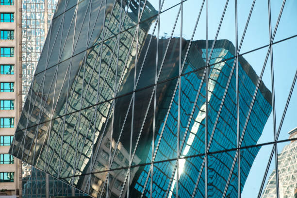 istock office building in business district in glass facade reflection - 1250962229