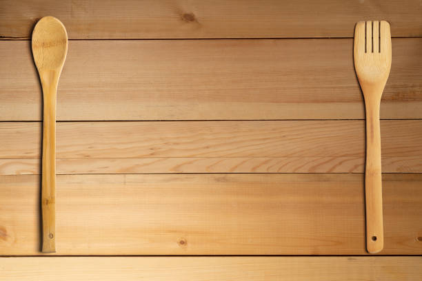 istock Wooden spoon and fork on wooden table. Kitchen and cooking concept. 1250962778