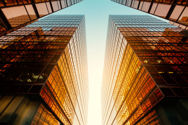 istock modern office building, sun reflection on glass facade 1250962785