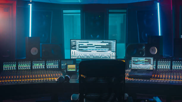 istock Shot of a Modern Music Record Studio Control Desk with Computer Screen show User Interface of DAW Software with Song Playing. Equalizer, Mixer and other Professional Equipment. 1250963239