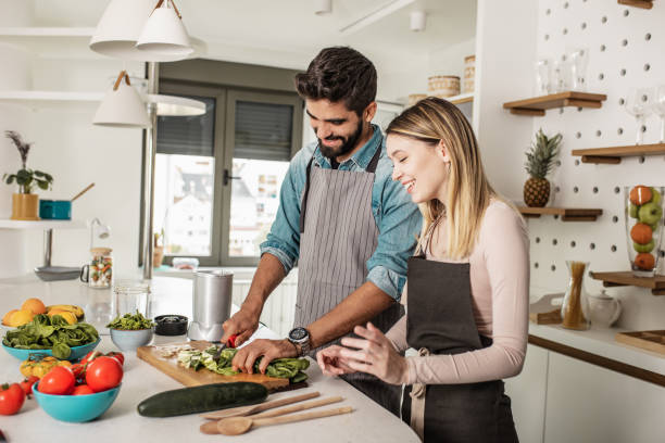 istock Young couple prepares a healthy drink 1250964362