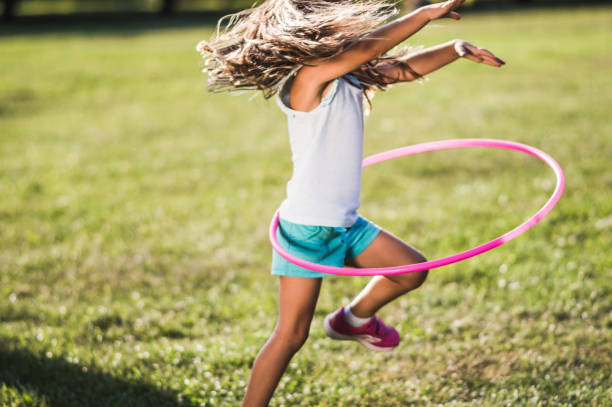 istock Beautiful girl with hula hoop 1250967872