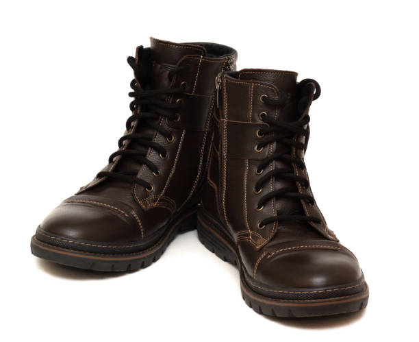 istock warm boots with fur inside, brown color, isolated on a white background 1250967926