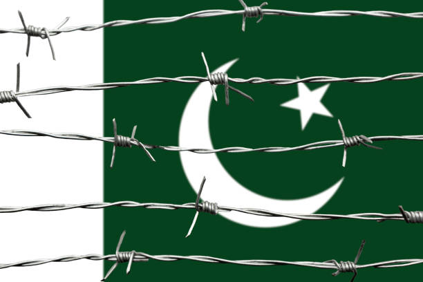 Pakistani Flag and barbed wire. Immigration concept. Border security.
