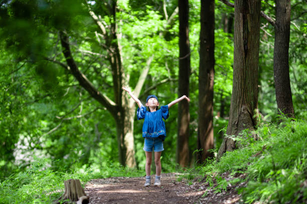 istock Girl playing in the forest 1250969218