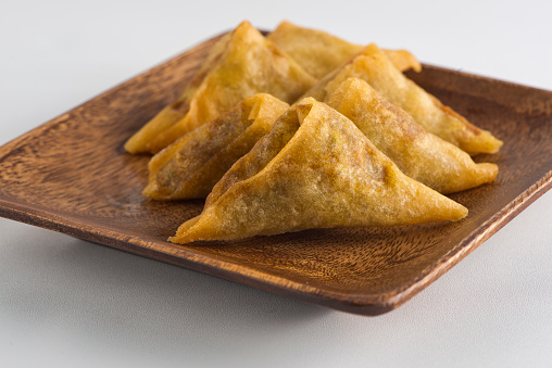 Empanadas. Classic traditional Latin American of Spanish street food favorite. A fried crispy pastry or turnover filed with seasoned meat, garlic herbs and spices served with spicy dipping sauces.
