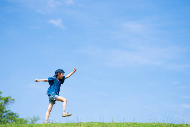 istock Child walking in the meadow 1250969769