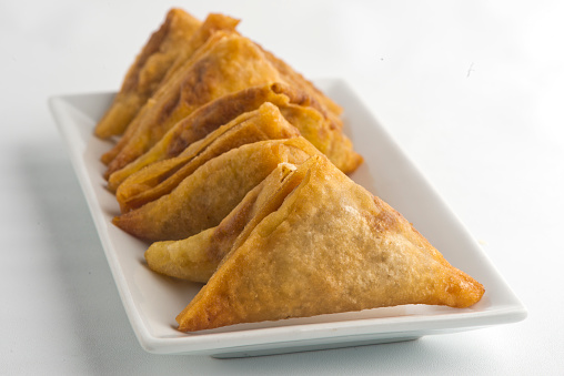Empanadas. Classic traditional Latin American of Spanish street food favorite. A fried crispy pastry or turnover filed with seasoned meat, garlic herbs and spices served with spicy dipping sauces.