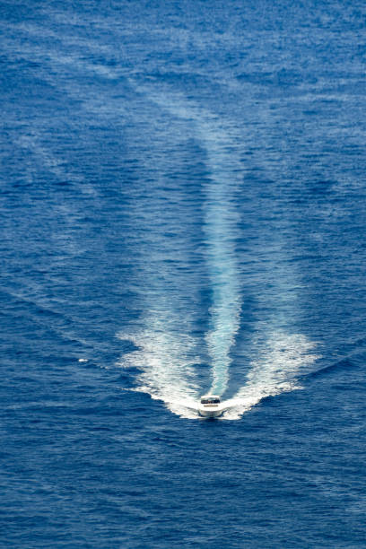 istock Motor boat with wake in blue sea 1250969902