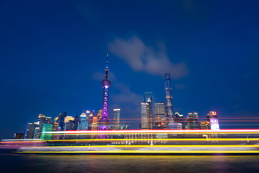 Downtown Shanghai skyline of modern skyscrapers view from The Bund promenade in south China long exposure