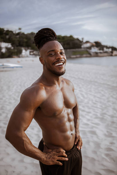 istock Confident sensual brazilian athlete on the beach 1250972703