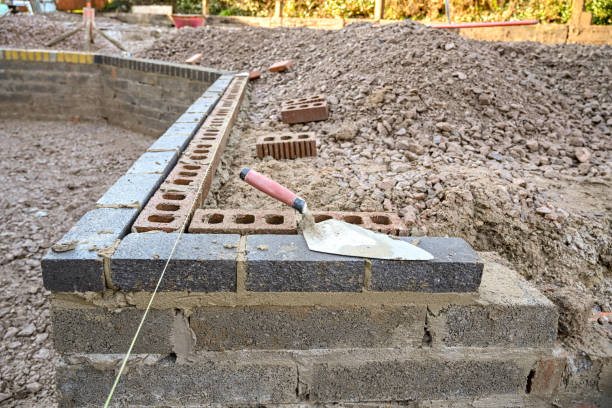 istock Bricklayer's trowel on partly build wall in a garden 1250972971